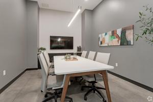 a dining room with a white table and chairs at CozySuites Marquee in Minneapolis +25 photos