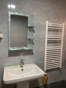 a bathroom with a sink and a mirror at Chinese home in Masis +33 photos