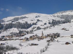 a small village in the snow with a mountain at Appartement T2 Hauteluce, 4 pers., piscine, parking, WiFi - FR-1-342-322 in Hauteluce