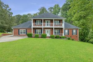 a large brick house with a large yard at Modern 1- Queen Bed On Quiet Block in Hephzibah