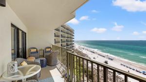 a balcony with a view of the beach at Beachfront Breeze by AvantStay Beachfront Condo in Panama City Beach