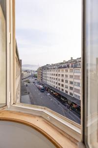 a view of a city street from a window at Spacious City View Apartment - Prime Location Biel in Biel