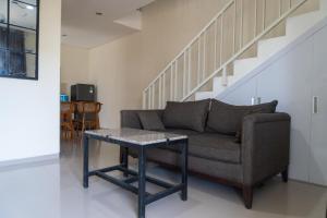 a living room with a couch and a table at Villa Exotic 22 Batu in Tlekung
