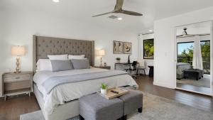 a bedroom with a large bed and a living room at Paso Vista Bella by AvantStay Luxe Group Escape w Wine Country Views in Paso Robles