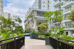 an apartment building with a walkway in front of it at Eazystay Gateway Pasteur in Bandung