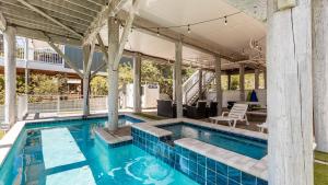 a swimming pool in a house with a pavilion at Seacrest Paradise by AvantStay Steps to the Beach Pet Friendly in Destin