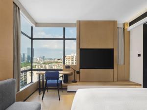 Телевизор и/или развлекательный центр в Fairfield by Marriott Guangzhou Huadu