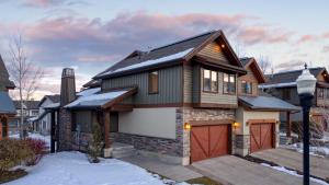 a house with a garage in the snow at Blue Skies Lakeside Family-Friendly Getaway w Hot Tub BBQ in Heber City