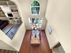 a dining room with a table and a chandelier at Avenida De Cortez in Bailey Hall