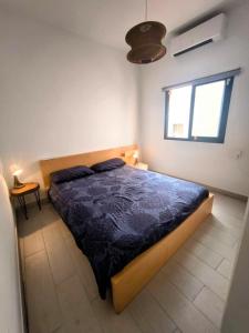 a bedroom with a bed and a window at Golf Villa 18 Los Abrigos in Los Abrigos