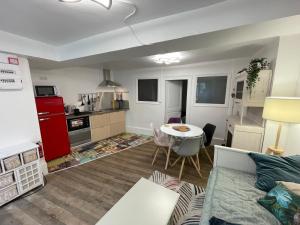 a living room with a couch and a table at L'Appart, le Morvan tranquille in Lormes