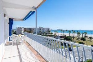 a balcony with a view of the beach at PINEDA III Apartment in La Pineda