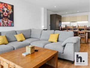 a living room with a couch and a table at FREE Parking - City Centre - Contractors - 20x Units Available in Hull