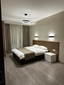 Postel nebo postele na pokoji v ubytování Krystal Bakuriani resort hotel 202C