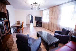 a living room with a couch and a table at Hotel Dilijan Old Center in Dilijan