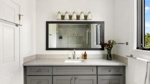a bathroom with a sink and a mirror at Edendale by AvantStay Urban Hilltop Oasis w Amazing Views in 3 of Los Feliz in Los Angeles +53 photos