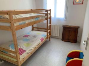 En eller flere senge i et værelse på L’Oasis de la Parée Bretignolles