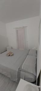 Postel nebo postele na pokoji v ubytování Casa del Faro