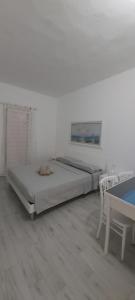 Postel nebo postele na pokoji v ubytování Casa del Faro