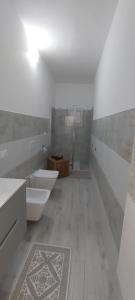 Koupelna v ubytování Casa del Faro + 3 fotografie