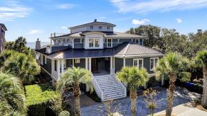 an image of a house with palm trees at 3100 Palm Boulevard by AvantStay Beachfront Ocean Views Private Pool in Isle of Palms