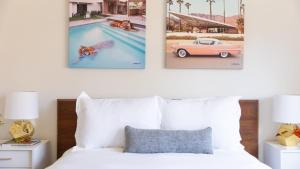 a bedroom with two pictures of a pool and a bed at Marilyn by AvantStay Mins to Old Town La Quinta in La Quinta +29 photos