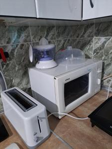 a white blender sitting on top of a microwave at Casa Tía Daniela AT CC- 00937 in Casas de Millán