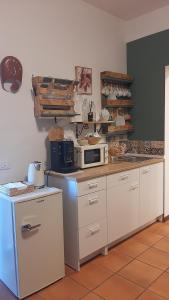 a kitchen with a counter top with a microwave at QuiVago in Ripe San Ginesio