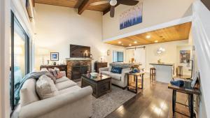 a living room with a couch and a fireplace at Near Ski Beach Hiking Trails Clubhouse Pool Hot Tub Access Juanita Blue by AvantStay in Incline Village