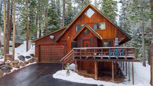 a cabin in the woods in the snow at Private Deck Fireplace and Ski Access Near Northstar The Lazy Bear in Truckee