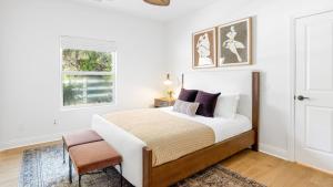 a white bedroom with a bed and a window at Pool Views Hot Tub Fire Pit Arcade Vista Clara by AvantStay in Temecula +63 photos