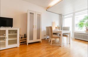 Μια τηλεόραση ή/και κέντρο ψυχαγωγίας στο Ferienapartment in 1A Lage
