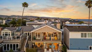 a house with a view of a city at Oceanfront Home Walk to Balboa Pier Scenic Views Balboa Peninsula Point by AvantStay in Newport Beach