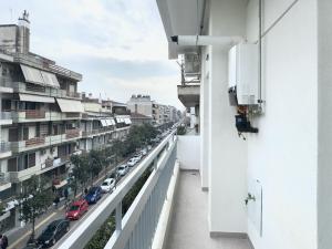 a balcony with a view of a city street at City Bliss Apartments Trikala town in Tríkala