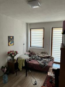 a bedroom with a bed and a window at Krzywa 27a apartament in Chełm