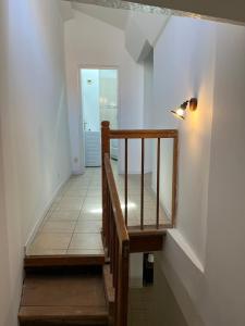 Ένα ή περισσότερα κρεβάτια σε δωμάτιο στο Appartement en duplex 2 chambres à La Réole