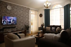 Μια τηλεόραση ή/και κέντρο ψυχαγωγίας στο Divehomes +4 φωτογραφίες