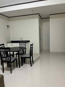 a dining room with a table and chairs in a room at Casa Dobos in Adya