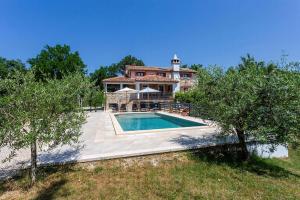 a house with a swimming pool in front of it at House Matija in Svetvinčenat