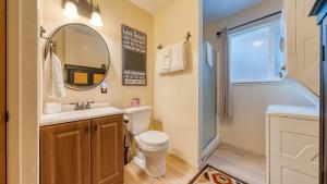 a bathroom with a toilet and a sink and a mirror at Mountain Cabin w Fireplace Balcony Easy Ski Access Bear Americana in Truckee +29 photos