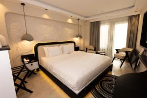 Ένα ή περισσότερα κρεβάτια σε δωμάτιο στο Porto De Galata Hotel +18 φωτογραφίες