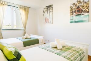 Ένα ή περισσότερα κρεβάτια σε δωμάτιο στο Britania Luxury +30 φωτογραφίες