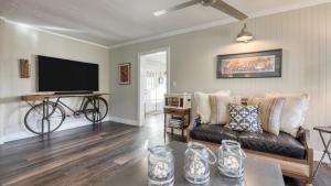 a living room with a couch and a flat screen tv at Luxury Wine Country Haven Vineyard Views Near Top Wineries Adelaida Farmhouse in Paso Robles