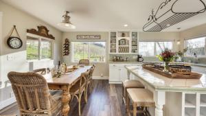 a kitchen with a large wooden table and chairs at Luxury Wine Country Haven Vineyard Views Near Top Wineries Adelaida Farmhouse in Paso Robles