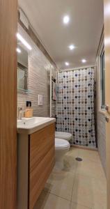 a bathroom with a sink and a toilet at Eagle & Dolphin Holiday Home in Taranto +21 photos