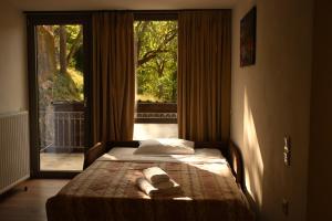 Una cama o camas en una habitación de Αρχοντικό