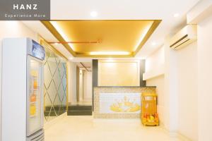 a hallway in a building with a yellow ceiling at S79 Crown Bui Vien in Ho Chi Minh City
