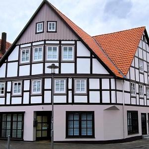 a black and white building with an orange roof at Apartment Amsterdam - Berlin in Lügde