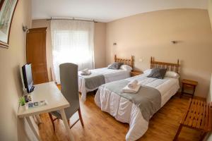 Ένα ή περισσότερα κρεβάτια σε δωμάτιο στο Hotel Voar