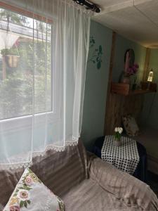 En eller flere senge i et værelse på Różany Ogród